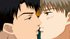 Two handsome gays kisses each other in the bedroom