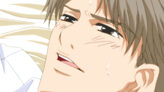 Two handsome gays kisses each other in the bedroom